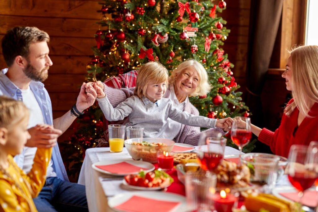 An older woman at a holiday dinner with her family