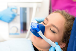 Dentist administering nitrous oxide sedation